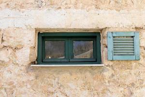 A small window in a residential building in a big city photo