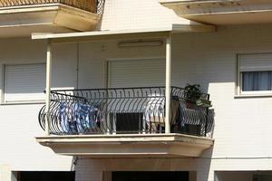 Balcony - a platform with railings protruding on the upper floors of the building. photo