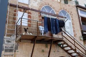 Balcony - a platform with railings protruding on the upper floors of the building. photo
