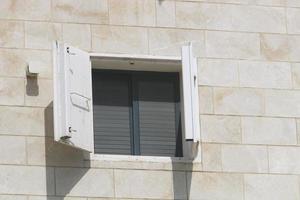 A small window in a residential building in a big city photo