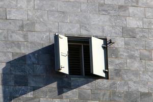A small window in a residential building in a big city photo