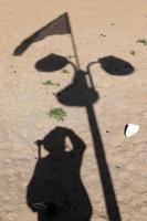 Photographer's shadow on the seashore. photo