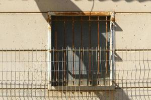 A small window in a residential building in a big city photo