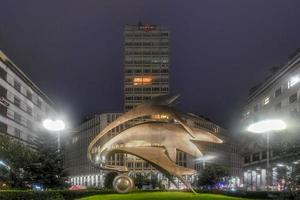 Milan, Italy - March 17, 2018 -   Cityscape with the old skyscraper in Piazza Diaz in Milan, built by Luigi Mattioni in 1956, with the terrazza martini on the roof. photo