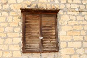 A small window in a residential building in a big city photo