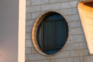A small window in a residential building in a big city photo