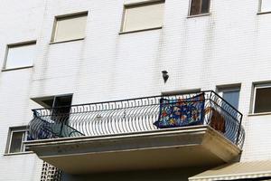 Balcony - a platform with railings protruding on the upper floors of the building. photo