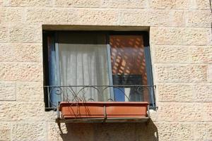 A small window in a residential building in a big city photo