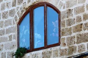 A small window in a residential building in a big city photo