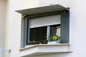 A small window in a residential building in a big city photo