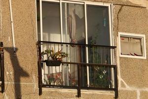 A small window in a residential building in a big city photo