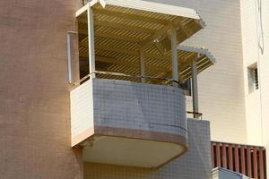 Balcony - a platform with railings protruding on the upper floors of the building. photo