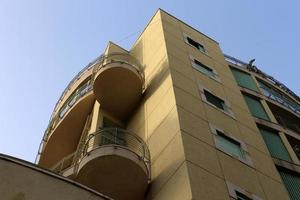 Balcony - a platform with railings protruding on the upper floors of the building. photo