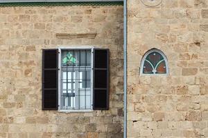 A small window in a residential building in a big city photo