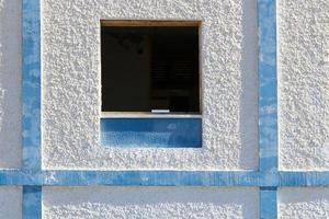 A small window in a residential building in a big city photo