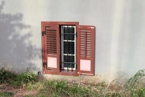 A small window in a residential building in a big city photo