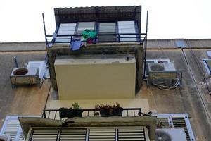 Balcony - a platform with railings protruding on the upper floors of the building. photo