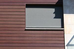 A small window in a residential building in a big city photo