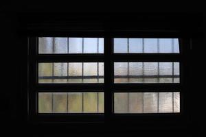 A small window in a residential building in a big city photo