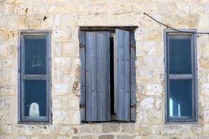 A small window in a residential building in a big city photo