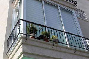 Balcony - a platform with railings protruding on the upper floors of the building. photo