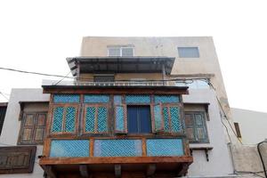 Balcony - a platform with railings protruding on the upper floors of the building. photo