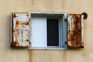 A small window in a residential building in a big city photo