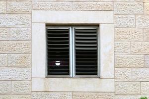 A small window in a residential building in a big city photo