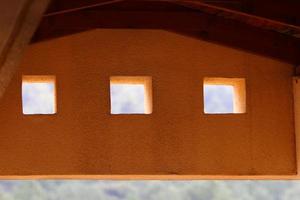 A small window in a residential building in a big city photo