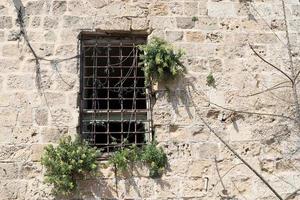 A small window in a residential building in a big city photo