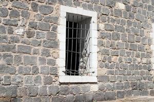 A small window in a residential building in a big city photo
