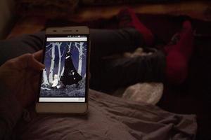 Closeup Of Smart Phone With Web Comics On It in Karachi Pakistan 2022 photo