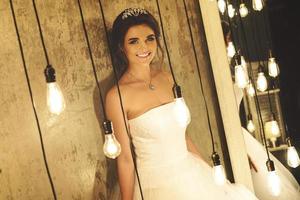 Young happy bride wearing beautiful lush dress photo