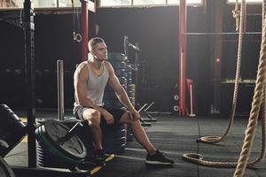 Man resting after his cross training workout photo