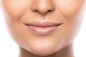 Close up of beautiful female lips on white background photo