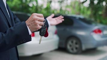 lease, rental car, sell, buy. Dealership manager send car keys to the new owner.  Sales, loan credit financial, rent vehicle, insurance,  renting, Seller, dealer, installment, car care business video