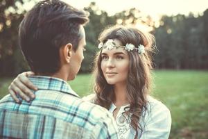 Portrait of young and beautiful couple at sunset photo