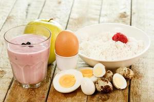 Healthy breakfast. Different food on wooden table. photo