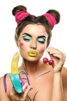 Beautiful model with creative pop art makeup photo