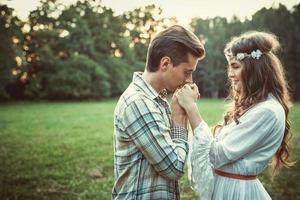 Portrait of young and beautiful couple at sunset photo