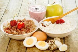 Healthy breakfast. Different food on wooden table. photo