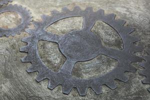 Old and rusty gears inside the concrete wall photo