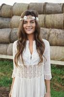 Woman wearing stylish white dress in the country side photo