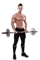 Young bodybuilder with barbell in studio on white background photo