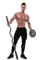 Young bodybuilder with barbell in studio on white background photo