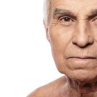 Portrait of senior man on white background photo