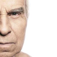 Portrait of senior man on white background photo