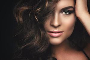 Woman with curly hair and beautiful make-up photo