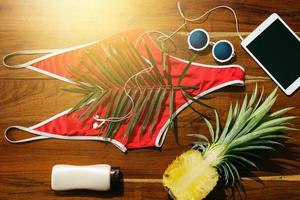 Flat lay of different items for beach vacations photo