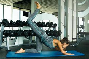 Sporty woman during her training in the gym photo